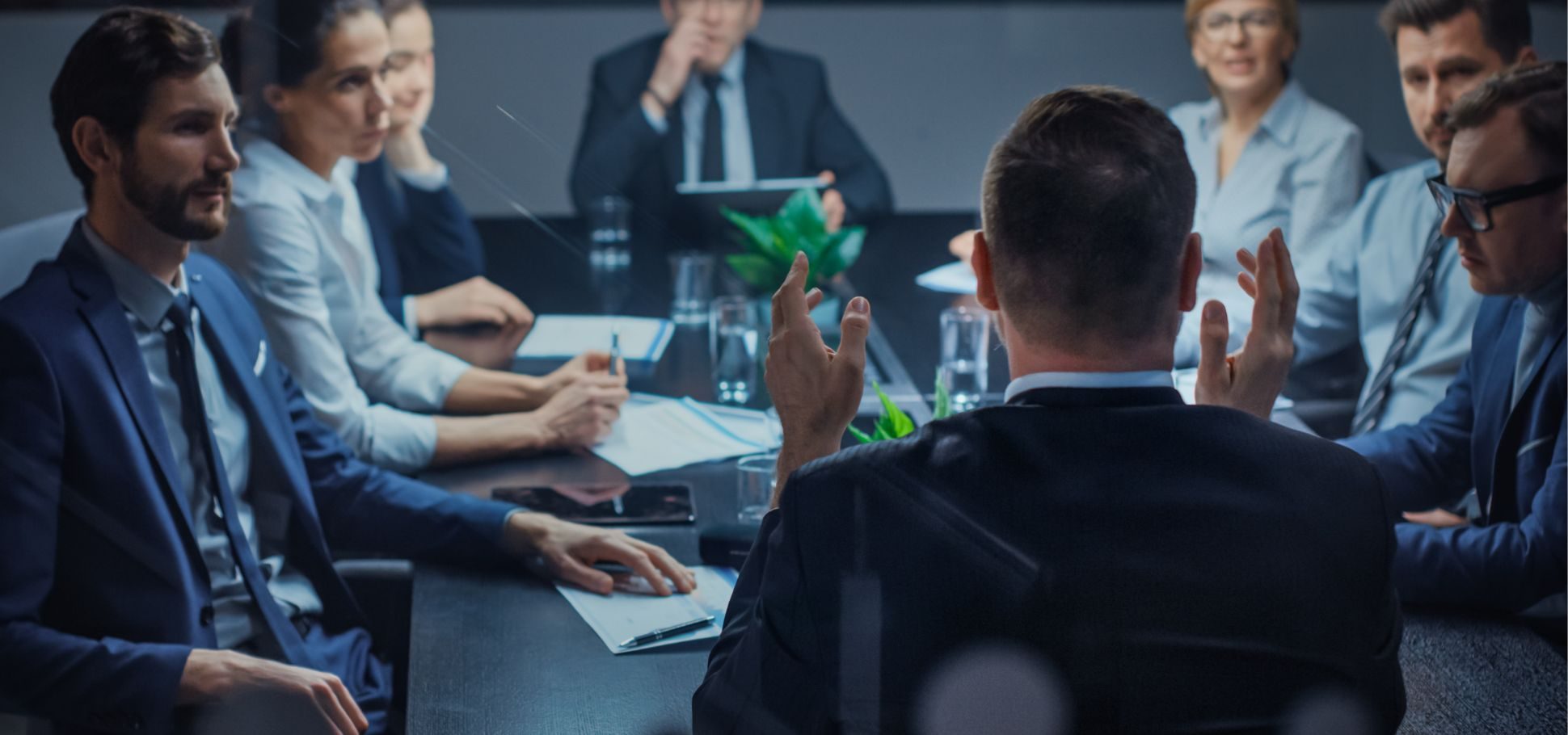 Business people sit together at a conference room having a discussion