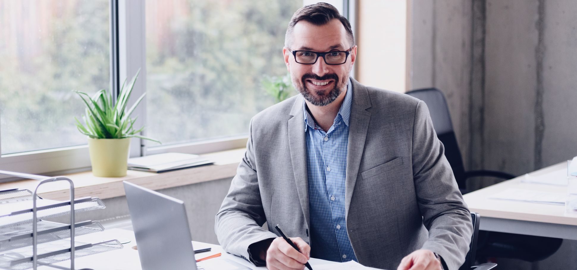 Man smiles in office