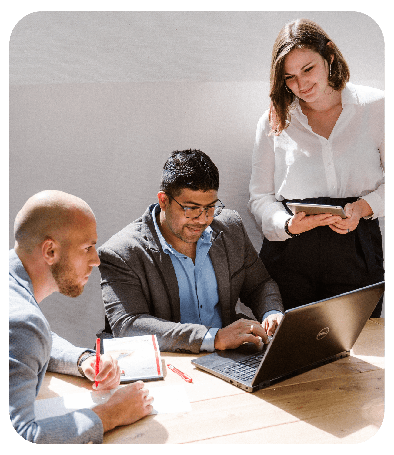 sana customer success team working around a laptop