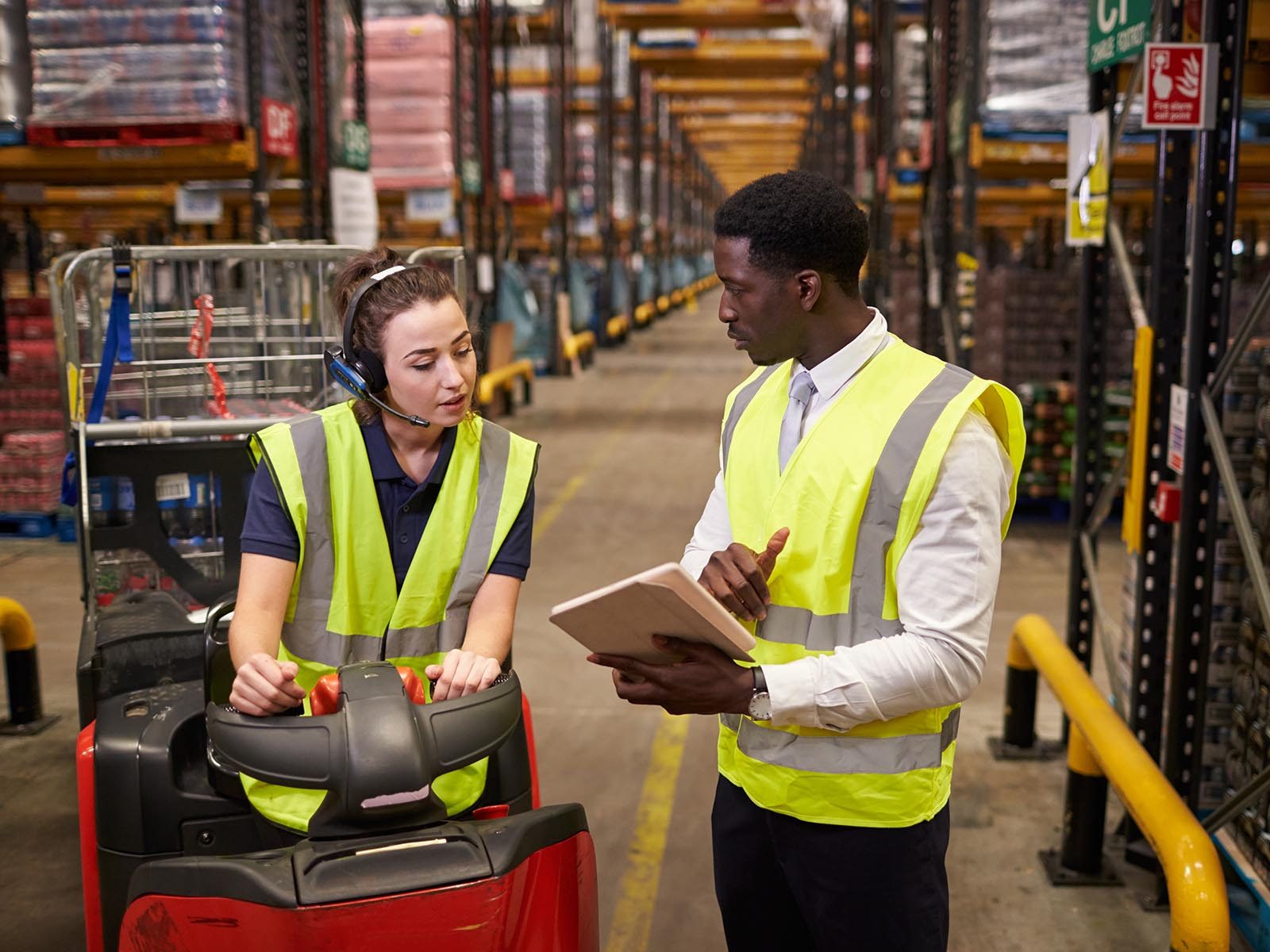 Two workers addressing supply chain issues