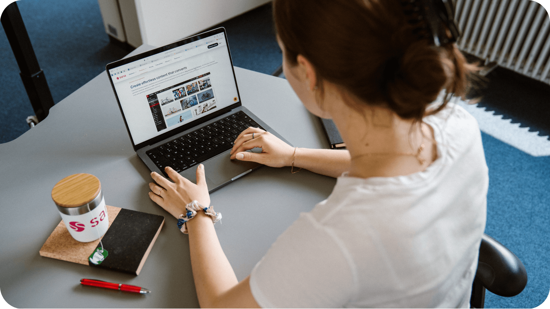 sana onboarding service woman using laptop on sana commerce website